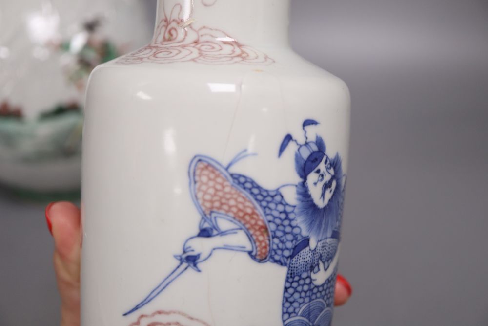 A Chinese famille verte bottle vase, an underglazed copper rouleau vase and a peacock, tallest 38cm